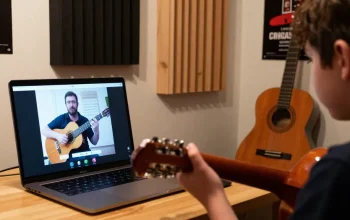 Engaged student participating in Zoom guitar lessons with classical music notes.